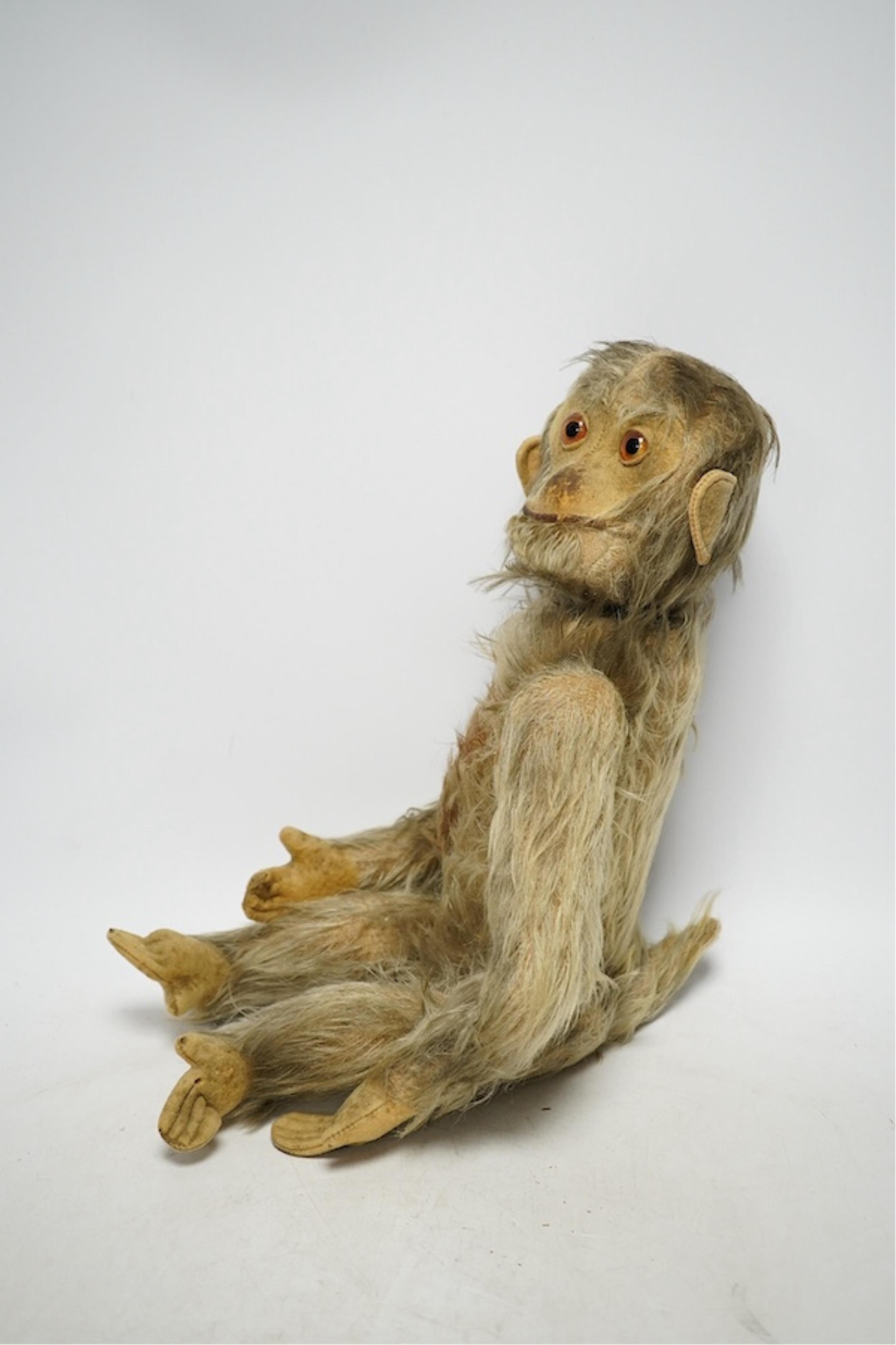 An early 20th century Schuco-type 'Yes No' monkey. Condition - fair, mechanism working